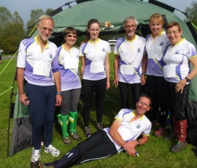 The team consider whether to carry Davie round his leg of the 8-person relay, 